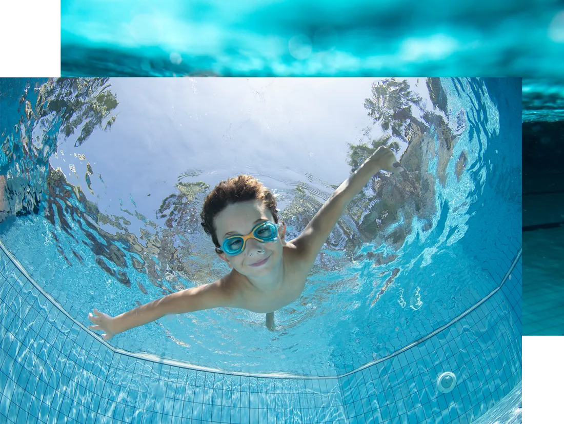 Underwater Young Boy Fun in the Swimming Pool with Goggles